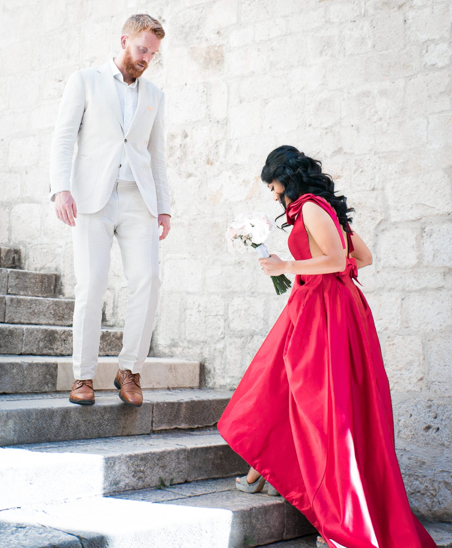 newlyweds on stairs by ruby photography