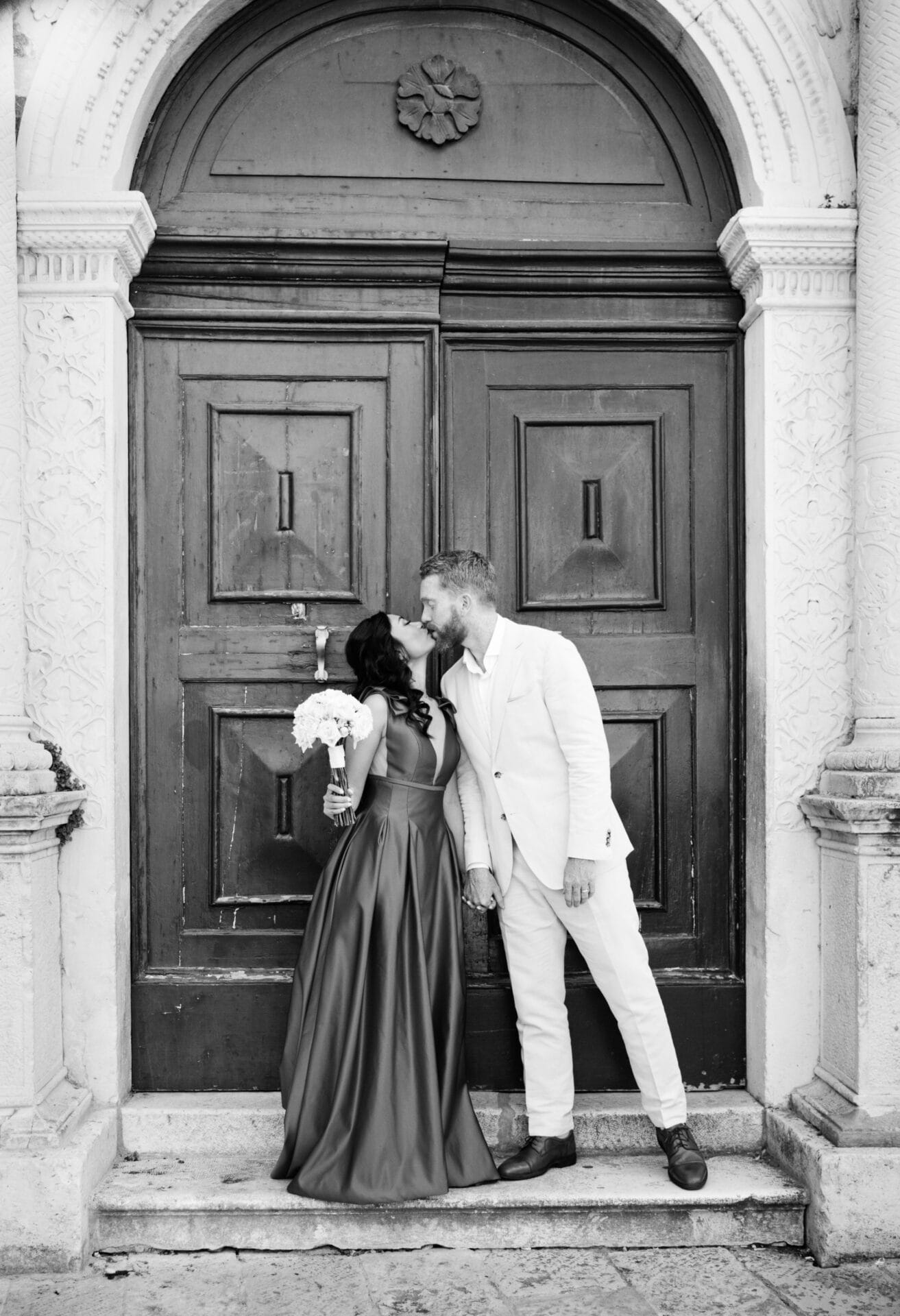newlyweds BW kissing by ruby