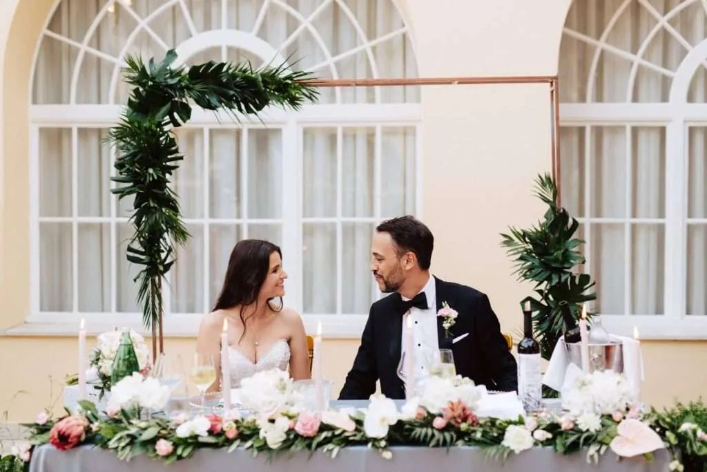 newlyweds sitting at their table